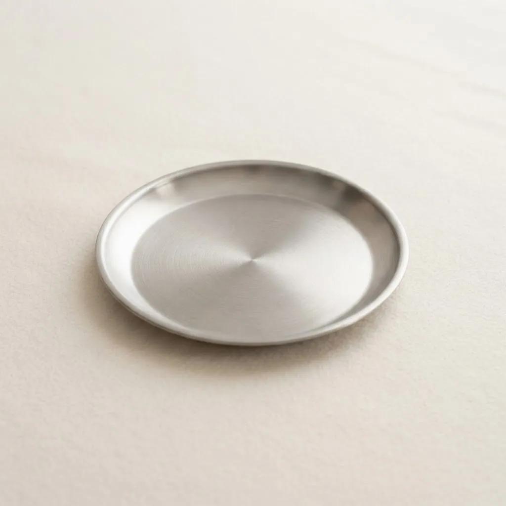 Klein dubbelwandig gebaksbordje van rvs, 17 cm